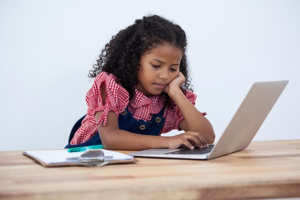 Girl contemplating on computer