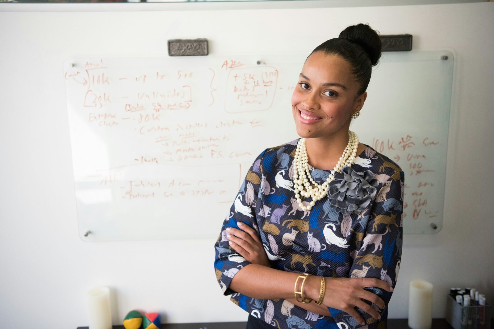 A STEM woman in blue and gray long-sleeved shirt wearing gold-coloured necklace